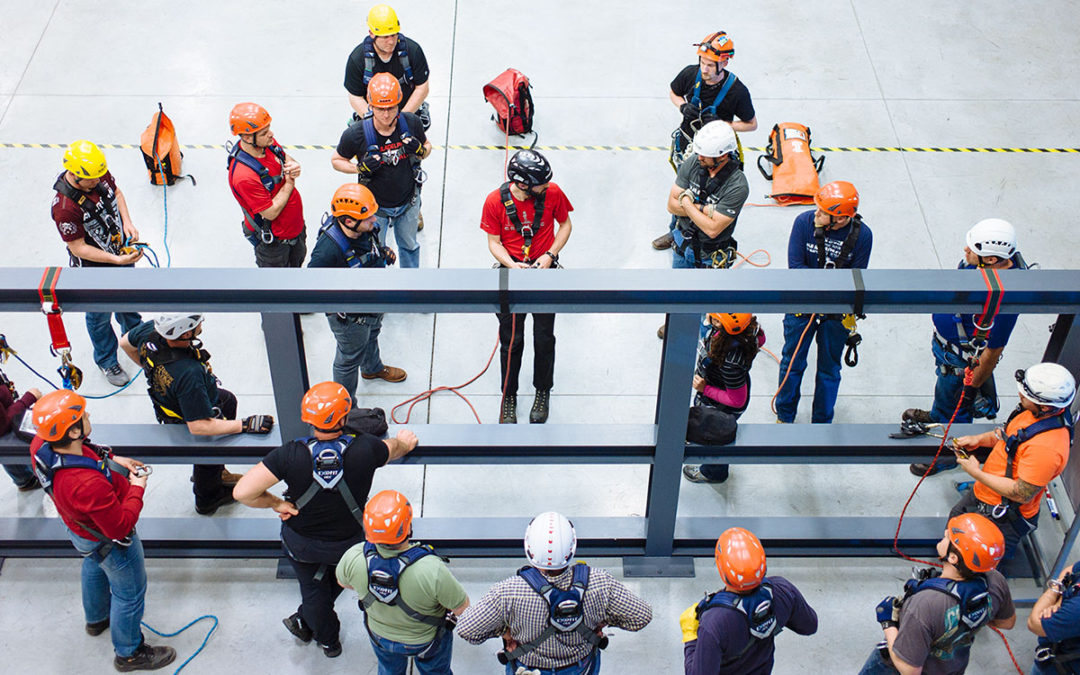 Who does OSHA say your Fall Protection & Rescue Trainer should be?